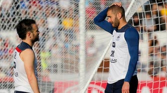 French police question Benzema in football sex tape inquiry 