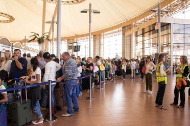 Tourists line up for luggage screening at the airport of Sharm el-Sheikh, Egypt, on Saturday, Nov. 7, 2015. London approved the resumption of British flights to Sinai starting Friday and planned a wave of flights to retrieve its stranded nationals, but it banned passengers from checking luggage on the flights. Instead, any checked-in bags were to be brought later on cargo planes. (AP Photo/Vinciane Jacquet)