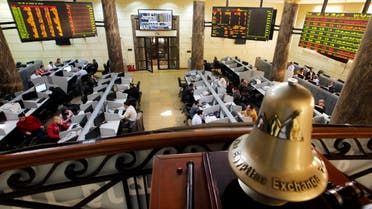 In this Saturday, March 10, 2013 file photo, Egyptian traders work on the floor of the stock market in Cairo, Egypt. AP