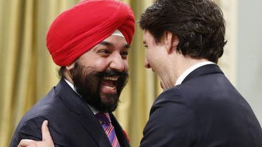 Canada's new Innovation, Science and Economic Development Minister Navdeep Bains is congratulated by Prime Minister Justin Trudeau. (AFP)