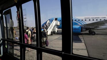 Passengers board an Egyptair Express plane bound for Cairo at Sharm el-Sheikh Airport, south Sinai, Egypt, Monday, Nov. 9, 2015. AP