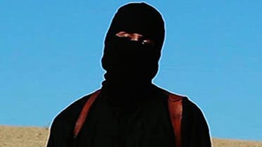 ISIS militant known as Jihadi John was filmed unmasked in Syria for the first time, promising to continue cutting 'heads off'. (Photo courtesy: SITE)
