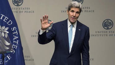 U.S. Secretary of State John Kerry waves after delivering remarks on the "U.S. strategy in Syria" at the United States Institute of Peace in Washington November 12, 2015. 