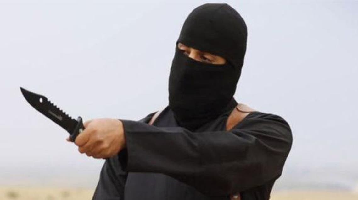 داعش ذبح إرهابي ملثم سكين يقطع رأس يجز