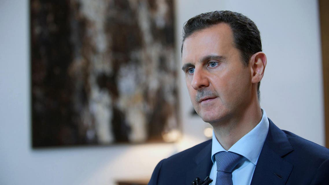  FILE - In this Sunday, Oct. 4, 2015 file photo released by the Syrian official news agency SANA, shows Syrian President Bashar Assad, speaking during an interview with the Iran's Khabar TV, in Damascus, Syria. (SANA via AP, File)
