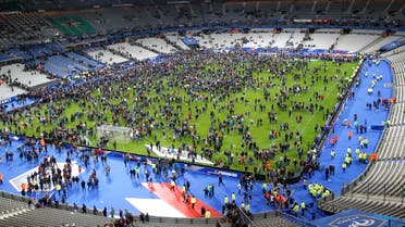  Spectators invade the pitch of the Stade de France stadium after the international friendly soccer France against Germany, Friday, Nov. 13, 2015 in Saint Denis, outside Paris. Multiple fatal attacks throughout the city have prompted President Francois Hollande to announce he was closing the country's borders and declaring a state of emergency. (AP Photo/Michel Euler)