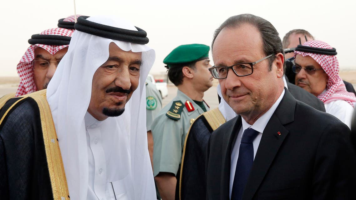 French President Francois Hollande, right, is greeted by Saudi Arabia’s King Salman upon his arrival at Riyadh airport, Saudi Arabia, Monday, May 4, 2015. Hollande is the guest of honor of the Gulf cooperation council summit in Riyadh, where security issues in the region are going to be discussed. (AP Photo/Christophe Ena, Pool)