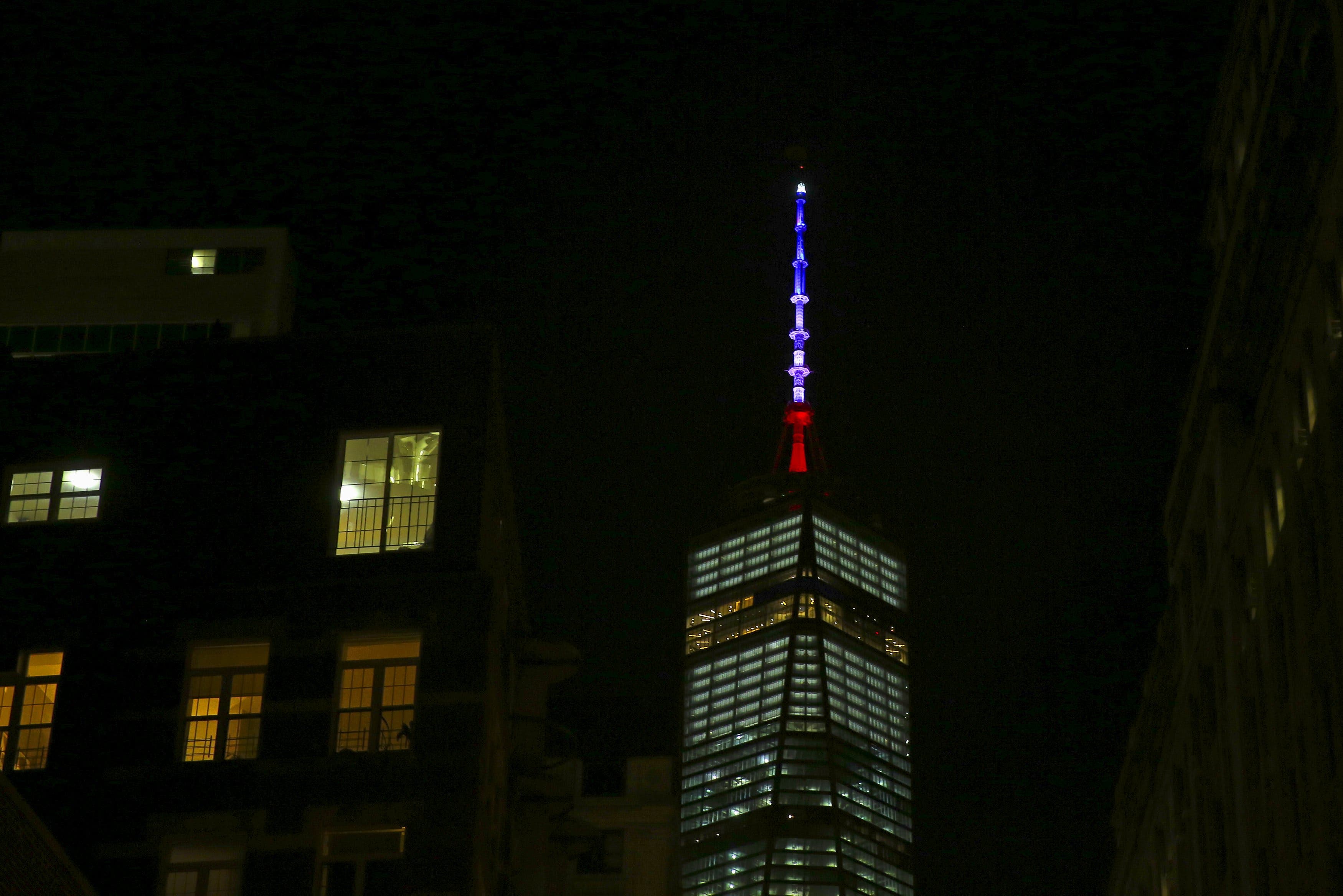 One World Trade Center is lit in the Blue, White and Red colors of the French flag in honor of the victims of the attacks in Paris, in the Manhattan borough of New York November 13, 2015. Reuters
