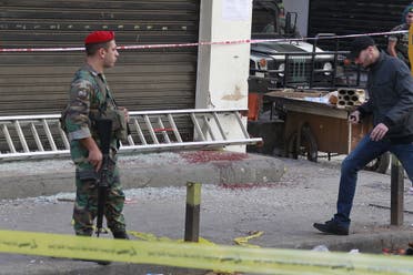 A Lebanese army soldier secures the area as blood stains are seen on the ground at the site of the two explosions that occured on Thursday in the southern suburbs of the Lebanese capital Beirut, November 13, 2015 REUTERS