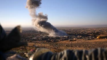 Smoke believed to be from an airstrike billows over the northern Iraqi town of Sinjar on Thursday, Nov. 12, 2015. AP