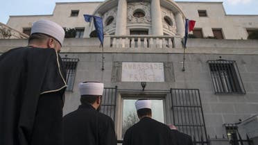 Representatives of the Muslim community in Serbia stand in front of French embassy to pay their respect to the victims of the attacks in Paris, in Belgrade, Serbia, November 14, 2015. reuters