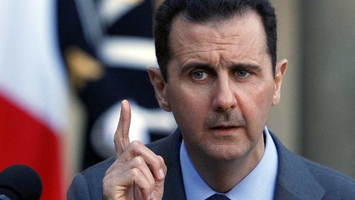 Syria President Bashar al-Assad addresses reporters following his meeting with French President Nicolas Sarkozy at the Elysee Palace in Paris, Thursday Dec. 9, 2010. (AP Photo/Remy de la Mauviniere)