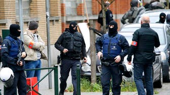 Brussels police surround houses seeking Paris suspects
