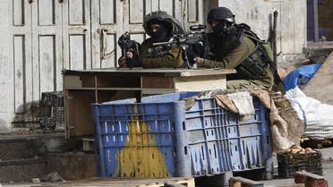 Israeli soldiers masked balaclavas west bank (Reuters)