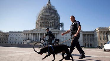 U.S. Capitol Police officers keep watch over the East Front of the Capitol as Congress prepares to return to work following the weekend terror attacks in Paris that killed 129 people, in Washington, Monday, Nov. 16, 2015. 