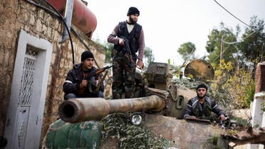  Kurdish members of the FSA are seen on a tank stolen from the Syrian Army in Fafeen village, north of Aleppo province, Syria, Wednesday, Dec 12, 2012 (AP Photo / Manu Brabo)