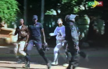 Still image from video show a hostage rushed out from the Radisson hotel in Bamako, Mali, November 20, 2015. (Reuters)