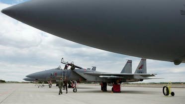 American military personnel walk next to an American fighter jets at Szentgyorgyi Dezso Air Base in Kecskemet, 85 kms (52 miles) southeast from Budapest, Hungary, Tuesday, Sept. 8, 2015. The US Airforce are scheduled to perform joint defence exercises over the coming days. (Szilard Koszticsak/MTI via AP)