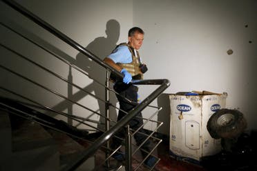 A U.N. official walks at a staircase covered in blood in the Radisson hotel in Bamako, Mali, November 20, 2015. (Reuters)