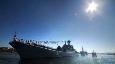 Russian navy battle ships station in the bay during a rehearsal of the Russian Navy Day parade in Sevastopol, Crimea, Friday, July 24, 2015. AP