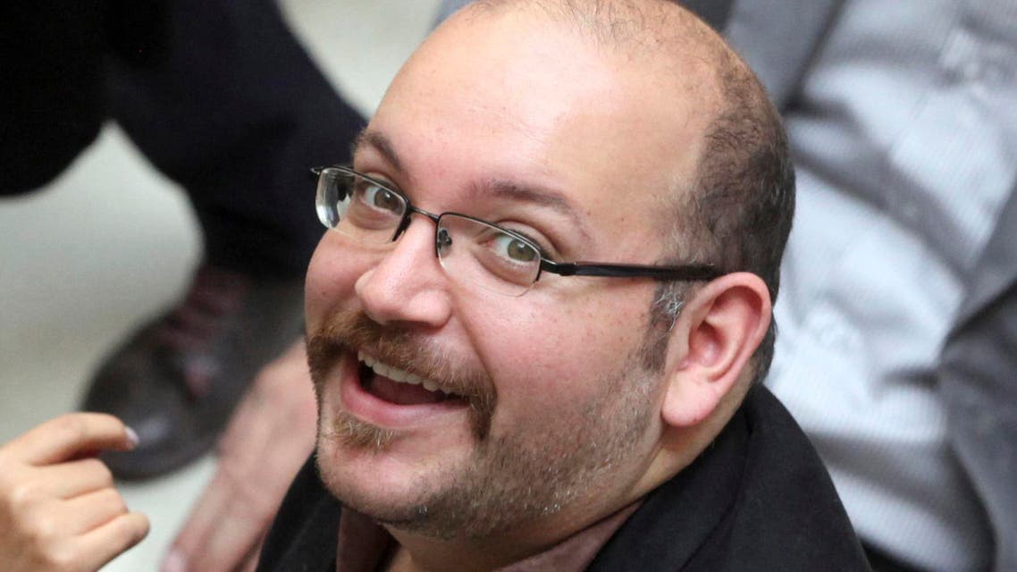 In this photo April 11, 2013 file photo, Jason Rezaian, an Iranian-American correspondent for the Washington Post, smiles as he attends a presidential campaign of President Hassan Rouhani in Tehran, Iran. AP