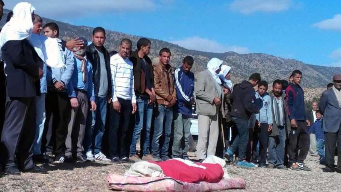 Tunisians praying before the burial of 16-year-old shepherd, Mabrouk Soltani, who was beheaded by jihadists. PHOTO: AFP