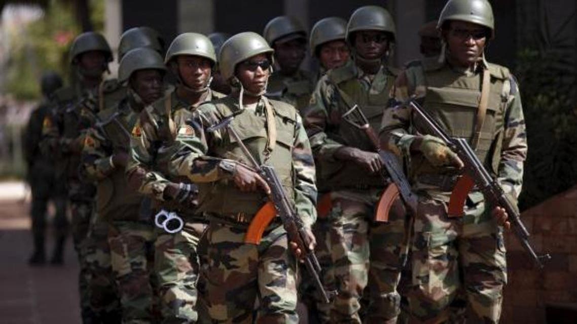 Soldiers patrol before the arrival of Mali's President Ibrahim Boubacar Keita outside the Radisson hotel in Bamako, Mali, November 21, 2015 following an attack by Islamist militants. REUTERS/Joe Penney
