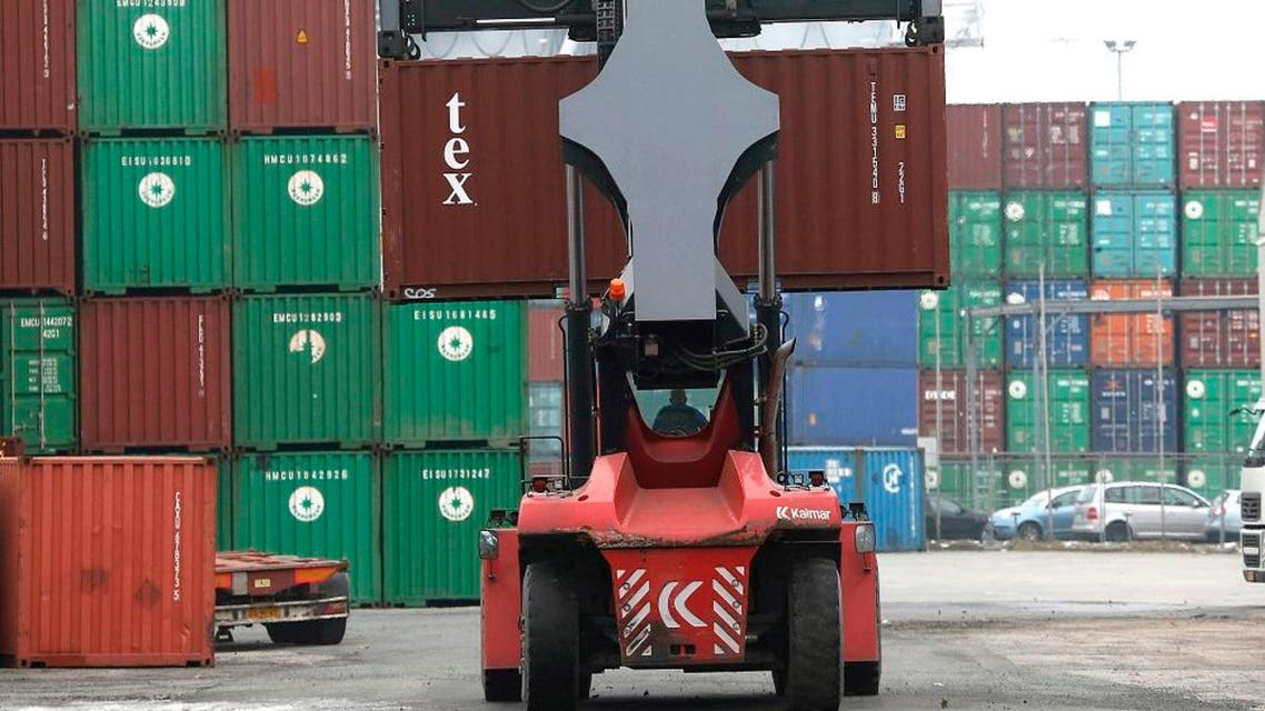 In this Feb. 14, 2013 file picture containers are piled up at the Duisburg harbor, Germany. German business optimism rose for the third straight month in January, giving a positive signal from Europe's biggest economy as executives foresee export gains from the weaker euro. The business climate survey from the Munich-based Ifo institute rose in December. Ifo President Hans-Werner Sinn said that "stronger impulses are expected from exports thanks to the falling euro exchange rate." Germany's export-oriented economy should benefit from the steep drop in the euro from just under US $1.40 in May to $1.13 on Monday Jan. 26, 2015 . (AP Photo/Frank Augstein,file)