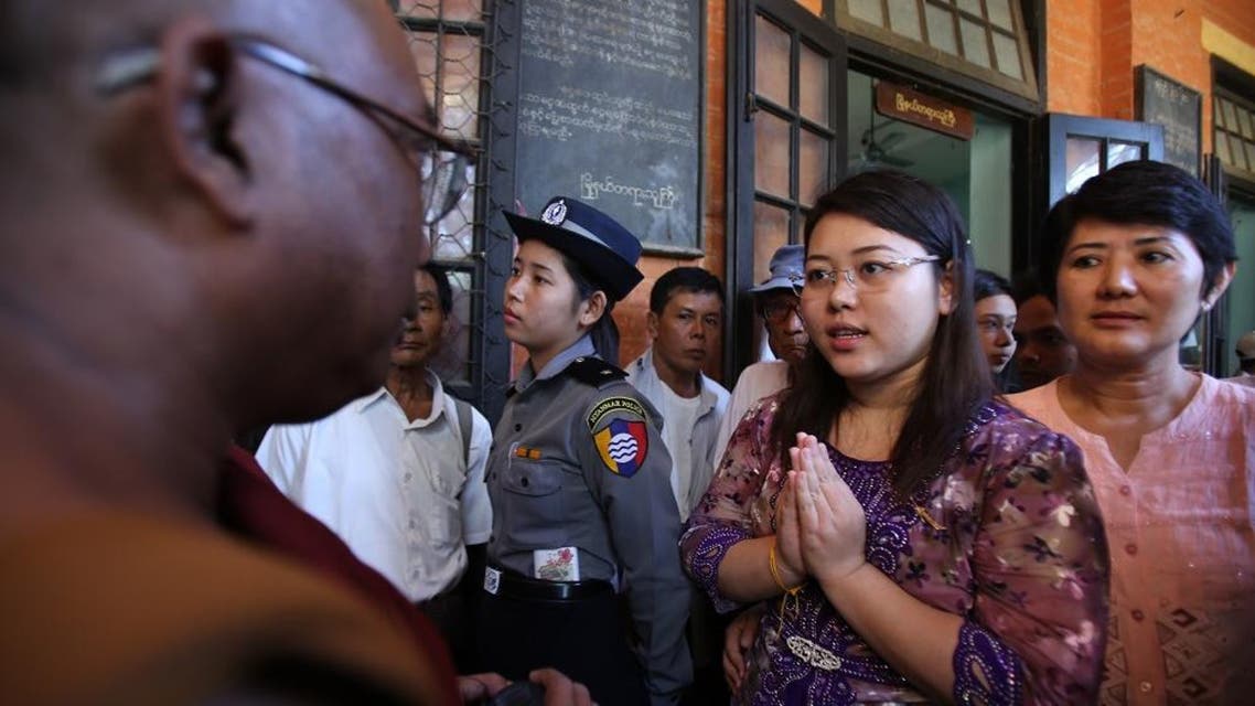 Student Chaw Sandi Tun, 25, speaks with a Buddhist monk after her hearing at court in Maubin, Myanmar, Tuesday, Nov. 24, 2015. Chaw returned to court Tuesday for poking fun at Myanmar's commander-in-chief on Facebook, highlighting the challenges faced by the country's former military rulers as they grapple with a social media explosion, street protests other newfound freedoms of expression. (AP Photo/Hau Dinh)
