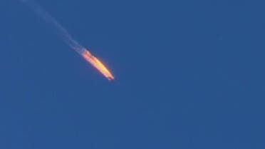 This frame grab from video by Haberturk TV, shows a Russian warplane on fire before crashing on a hill as seen from Hatay province, Turkey, Tuesday, Nov. 24, 2015 | AP