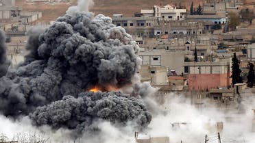 Smoke and flames rise over a hill near the Syrian town of Kobane after an airstrike last year. (Reuters)