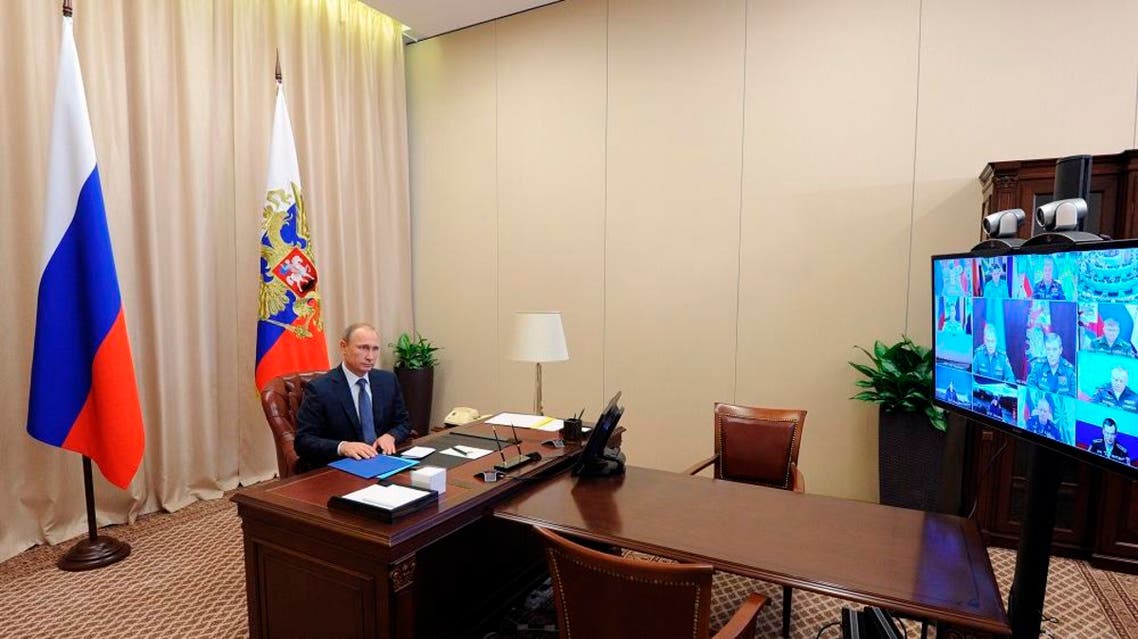 Russian President Vladimir Putin holds a video conference with the top military brass on a Russian air campaign in Syria, in the Novo-Ogaryovo residence outside Moscow, Russia, Friday, Nov. 20, 2015 | Reuters