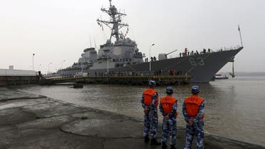 Chinese People's Liberation Army (PLA) navy soldiers stand guard as USS Stethem (DDG 63) destroyer vessel arrives at a military port for an official visit, in Shanghai, China, November 16, 2015 | Reuters