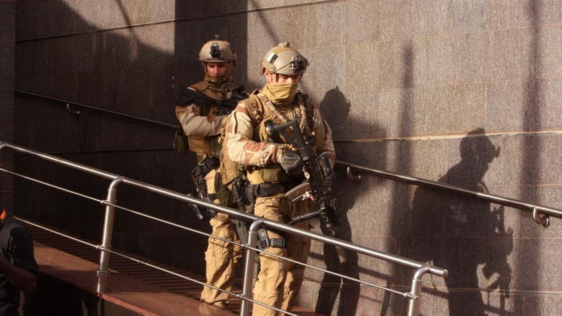 Soldiers leave the Radisson Blu hotel, after assisting Mali soldiers during an attack by gunmen on the hotel in Bamako, Mali, Friday, Nov. 20, 2015.| AP