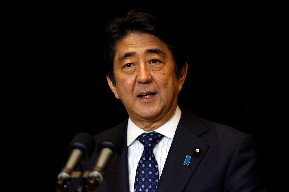Japanese Prime Minister Shinzo Abe speaks during a press conference in Kuala Lumpur, Malaysia, Sunday, Nov. 22, 2015. (AP Photo/Lai Seng Sin)