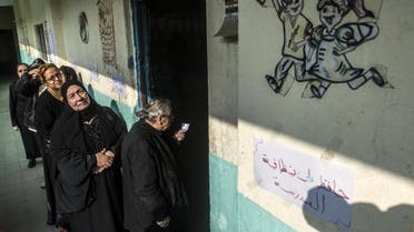 Egyptian women queue at a Cairo polling station on November 22, 2015, in what has proved to be a low-turnout parliamentary election, with less than a third of voters casting ballots. (AFP)