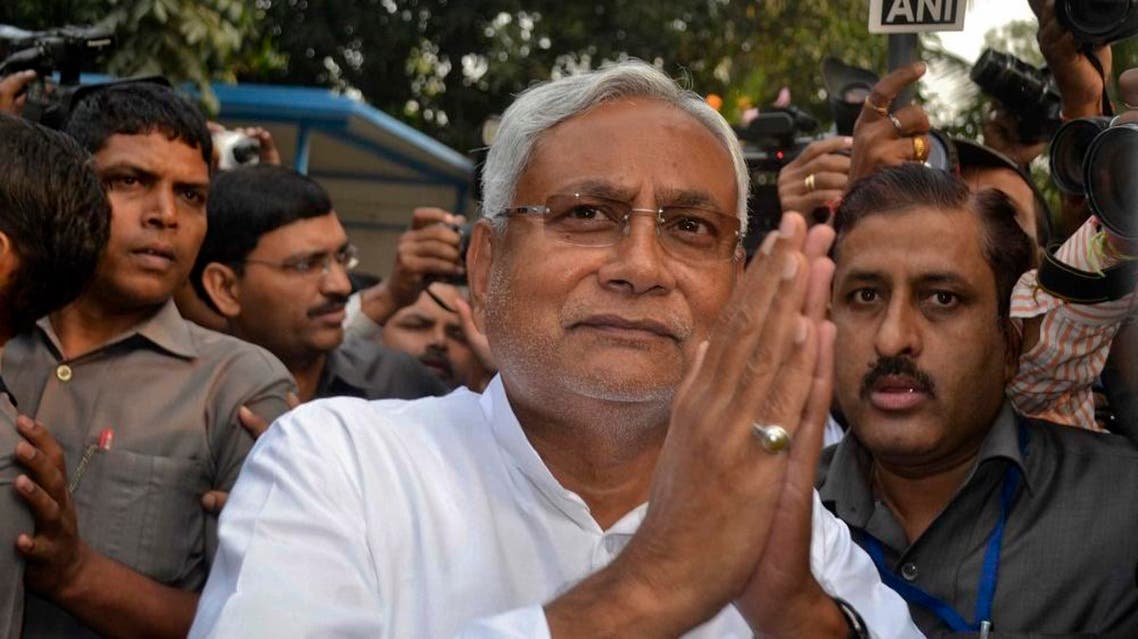Bihar Chief Minister Nitish Kumar greets supporters after victory in Bihar state elections in Patna, India, Sunday, Nov. 8, 2015. | AP