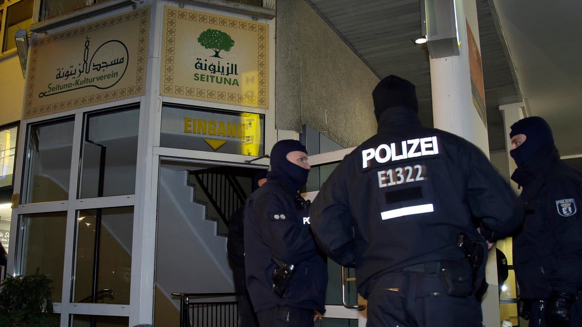 Police officers guard the 'Seituna' cultural society in Berlin, Germany, Thursday, Nov. 26, 2015.