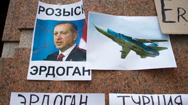 Posters showing a portrait of Turkish President Recep Tayyip Erdogan and reading "Wanted," "Erdogan, Turkey," are left after a protest at the Turkish Embassy in Moscow, Russia, Wednesday, Nov. 25, 2015. (Reuters)