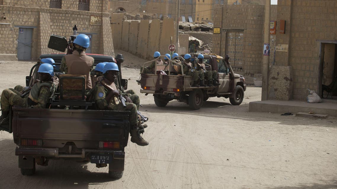 United Nations peacekeepers from Burkina Faso patrol through Timbuktu, Mali, Tuesday, July 23, 2013.