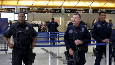 Los Angeles Airport Police officers keep watch inside Tom Bradley International Terminal at Los Angeles Airport in Los Angeles, California November 24, 2015 | Reuters\