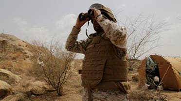 A Saudi soldier looks with binoculars toward the border with Yemen in Jazan, Saudi Arabia. (File photo: AP)