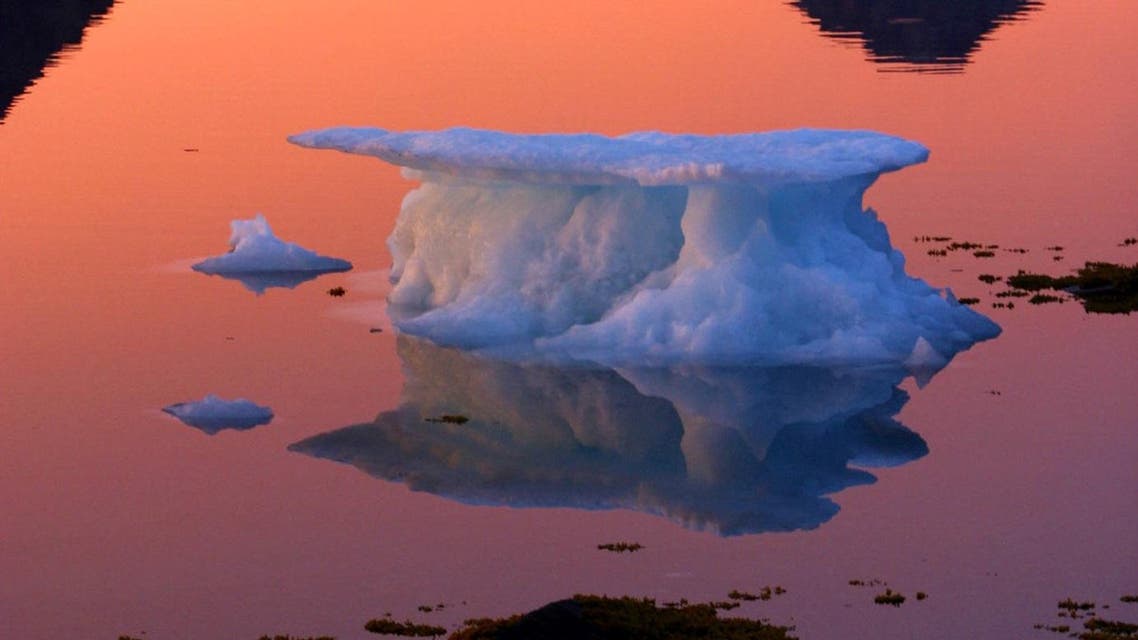 An iceberg floats in the bay in Kulusuk, Greenland near the arctic circle in this Aug. 16, 2005 file photo. (AP)