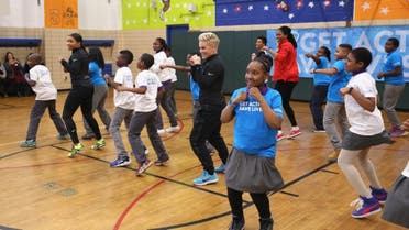 Grammy award winner Pink (C) celebrates nationwide launch of UNICEF Kid Power with New York City school children at PS 242. (AFP)