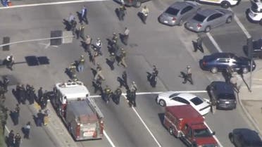 A still image from a video footage courtesy of Nbcla.com shows first responders responding to a shooting at the California Department of Developmental Services Inland Regional Center, one of 21 facilities serving people with developmental disabilities, in San Bernardino, California December 2, 2015. Three people were killed and as many as 20 were wounded on Wednesday when at least one person opened fire at a social services agency in the Southern California city of San Bernardino, authorities and a witness said. REUTERS/NBCLA.COM/Handout FOR EDITORIAL USE ONLY. NOT FOR SALE FOR MARKETING OR ADVERTISING CAMPAIGNS. THIS IMAGE HAS BEEN SUPPLIED BY A THIRD PARTY. IT IS DISTRIBUTED, EXACTLY AS RECEIVED BY REUTERS, AS A SERVICE TO CLIENTS. NO SALES. MANDATORY CREDIT NO RESALES. NO ARCHIVE