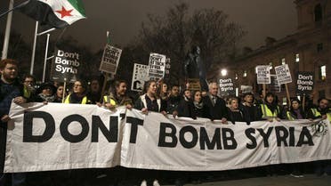 Anti-war protesters demonstrate against proposals to bomb Syria outside the Houses of Parliament in London. (Reuters)