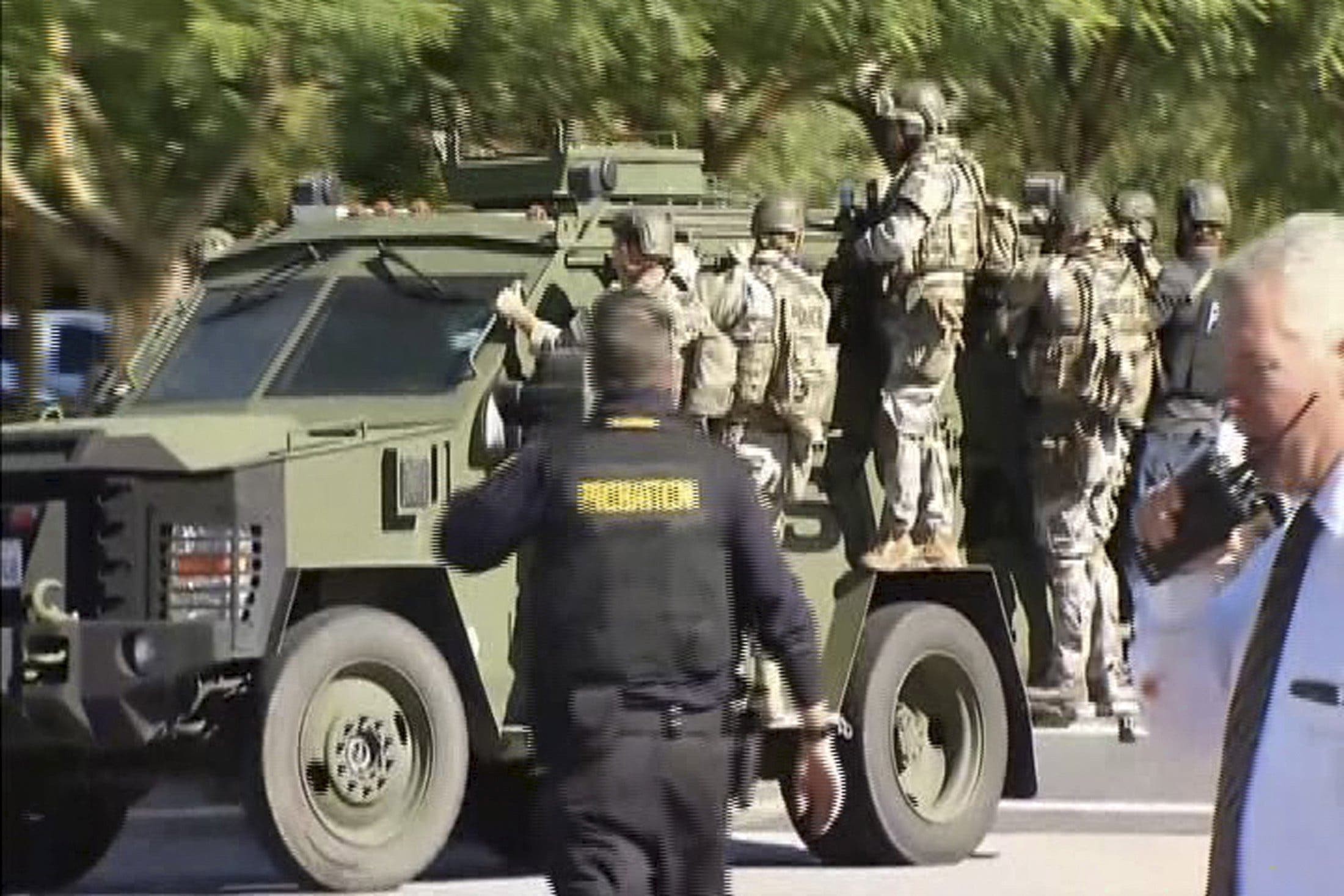 Police SWAT team members ride on a armored vehicle outside the Inland Regional Center in San Bernardino, California in this still image taken from video December 2, 2015. At least 20 people were reported injured in an active shooter situation, according to news reports. REUTERS/NBCLA.com/Handout via Reuters NO SALES. FOR EDITORIAL USE ONLY. NOT FOR SALE FOR MARKETING OR ADVERTISING CAMPAIGNS. THIS IMAGE HAS BEEN SUPPLIED BY A THIRD PARTY. IT IS DISTRIBUTED, EXACTLY AS RECEIVED BY REUTERS, AS A SERVICE TO CLIENTS NO RESALES. NO ARCHIVE TPX IMAGES OF THE DAY