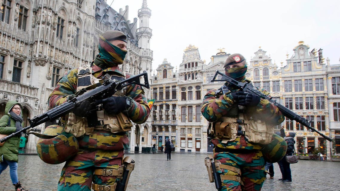 FILE - In this Tuesday, Nov. 24, 2015 file photo, Belgium police officers patrol the Grand Place in central Brussels. A four day lockdown due to a heightened security threat closed the capital’s subways and schools. Officials recommended that popular shopping districts be shuttered and advised people to avoid public places since they could be targeted by extremists. (AP Photo/Michael Probst, File)