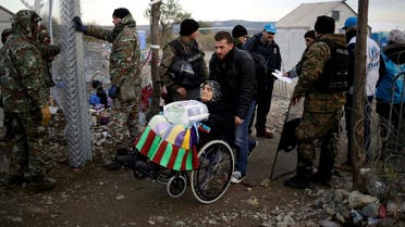 Elderly migrant in wheelchair crosses Macedonian-Greek border near Gevgelija. (File photo: Reuters)