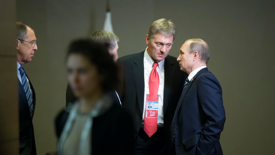 Russian President Vladimir Putin, right, speaks to his press secretary Dmitry Peskov, second right, as Russian Foreign Minister Sergey Lavrov, left, looks at them after their talks with British Prime Minister David Cameron at the G-20 Summit in Antalya, Turkey, Monday, Nov. 16, 2015. (AP Photo/Alexander Zemlianichenko)